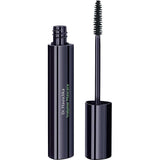 A sleek black tube of Dr Hauschka Volume Mascara 8ml stands upright with the wand, featuring a bristled brush, placed beside it. Perfect for sensitive eyes.