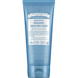 A blue tube of Dr Bronner's Organic Shaving Soap - Baby Unscented (207ml), ideal for sensitive skin, features white and light blue text noting "Certified Fair Trade" and "Smooth & Moisturizing.