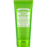 A green 207ml tube of Dr Bronner's Organic Shaving Soap - Lemongrass Lime stands upright against a white background, displaying white text with its certifications, ingredients, and features.
