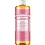 A 945 ml bottle of Dr. Bronner's Pure-Castile Liquid Soap - Cherry Blossom features a pink label, white cap, yellow liquid, and detailed text about its many uses and ingredients on the packaging.