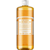 A clear bottle of Dr. Bronner's Pure-Castile Liquid Soap - Citrus with a white cap and orange label displays branding and product info; the golden-yellow, citrus-scented soap inside is suitable for multiple uses.