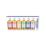 The Dr. Bronner's Rainbow Sampler Pack 6 x 59ml features six small bottles of Pure-Castile Liquid Soap in assorted colors and scents, arranged side by side and labeled "Rainbow Sampler" inside the packaging.