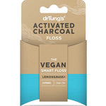 Packaged vegan activated charcoal floss with 'drTungs' branding on a white background