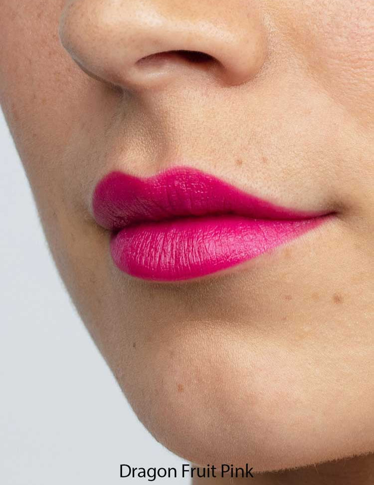 Close-up of a person’s lower face with smooth, light skin and bright pink “Dragon Fruit Pink” Antipodes Moisture Boost Natural Lipstick 4g, enriched with avocado oil for nourishment and vibrant color.