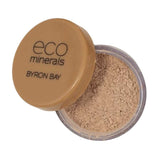 An open container of Eco Minerals Perfection Dewy Mineral Foundation 5g in a small round jar with a tan lid labeled eco minerals BYRON BAY, providing a natural dewy finish.