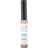 A tube of Eco Minerals Mineral Alchemy High Light Creme 8g with a black cap and white label with gold accents is displayed against a plain white background, offering a luminous glow.