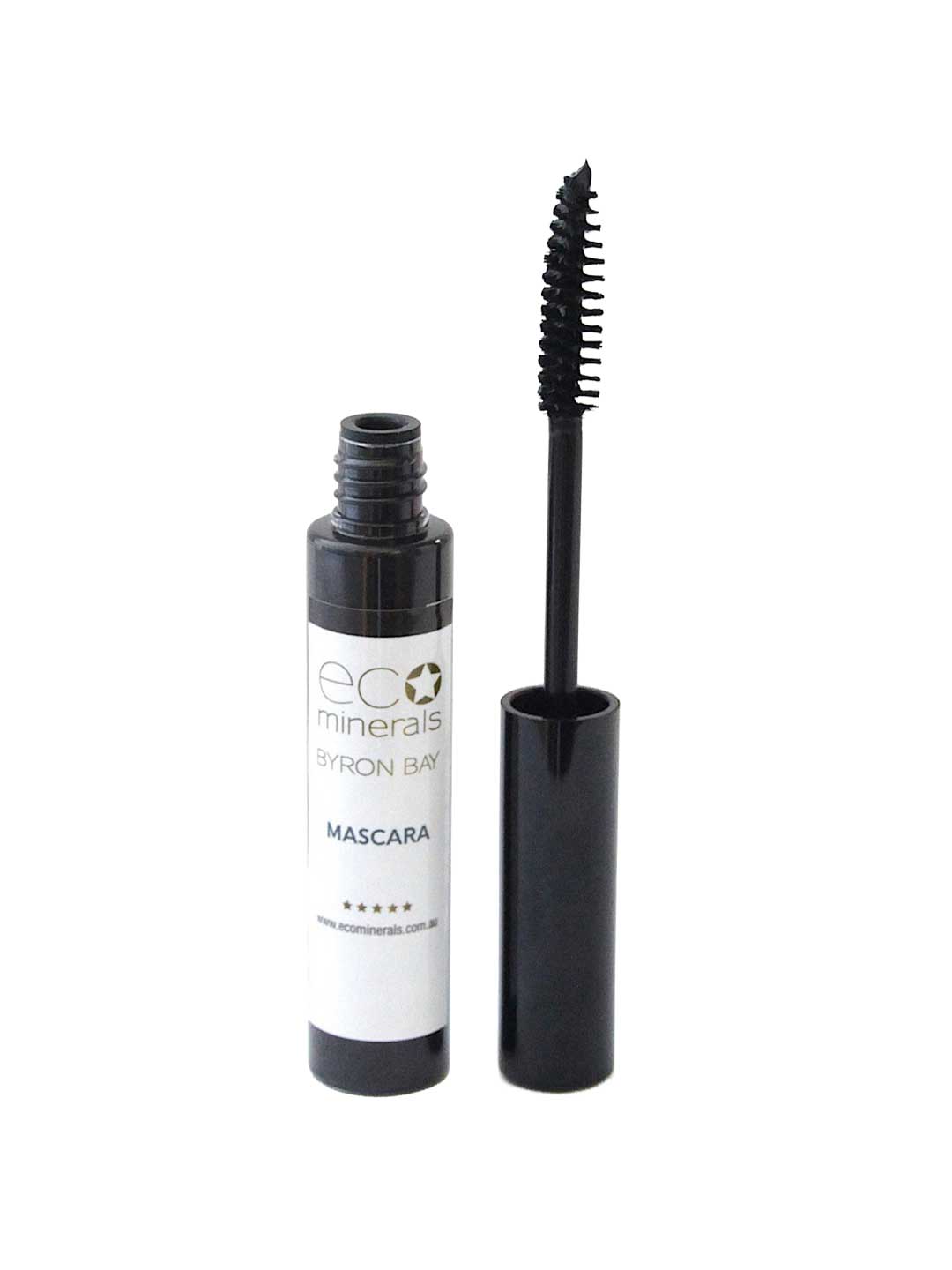 An open tube of Eco Minerals Natural Mascara 8g with its wand applicator resting next to it, showing black bristles and a white label on the tube.