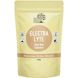 Eden Healthfoods Electra-Lyte Pineapple and Apple in a pale yellow resealable pouch with a tan circular label, white lettering and four small black-and-white symbols.