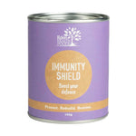 A cylindrical purple tin labeled Eden Healthfoods Immunity Shield 100g features "Boost your defence," "Protect. Rebuild. Restore.", certified organic, and Echinacea angustifolia for immune support on the front.