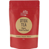A red stand-up pouch of Edible Herbs Organic Dtox Tea Blend, featuring a beige circular label with black text on a white background.