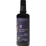 A sleek spray bottle labeled Edible Beauty No. 2 Citrus Rhapsody Toner Mist 50ml offers collagen support and pore refinement with green tea, niacinamide, and Australian desert lime in a simple, elegant design.
