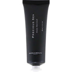 A black tube of Edible Beauty Precious Sea Hand Saviour 50ml with Snowflower Seed Oil and a white cap stands upright against a white background.