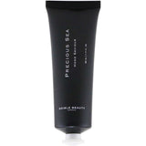 A black tube of Edible Beauty Precious Sea Hand Saviour 50ml with Snowflower Seed Oil and a white cap stands upright against a white background.