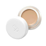 The Ere Perez Arnica All-Cover Pot 5g is a small round jar of beige concealer with a white lid embossed with "ep," slightly open to show the product inside. It offers buildable coverage and may contain skin-soothing arnica.