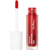 The Ere Perez Beetroot Cheek & Lip Tint - Joy 4.5ml features a frosted tube with white cap and wand, revealing vibrant red tint for natural, long-lasting colour on lips and cheeks.