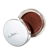 An open Ere Perez Cacao Bronzing Pot - Costa (7.5g) shows shimmery brown cream bronzer eyeshadow in a round container with a shiny silver lid embossed with the Ere Perez brand name.