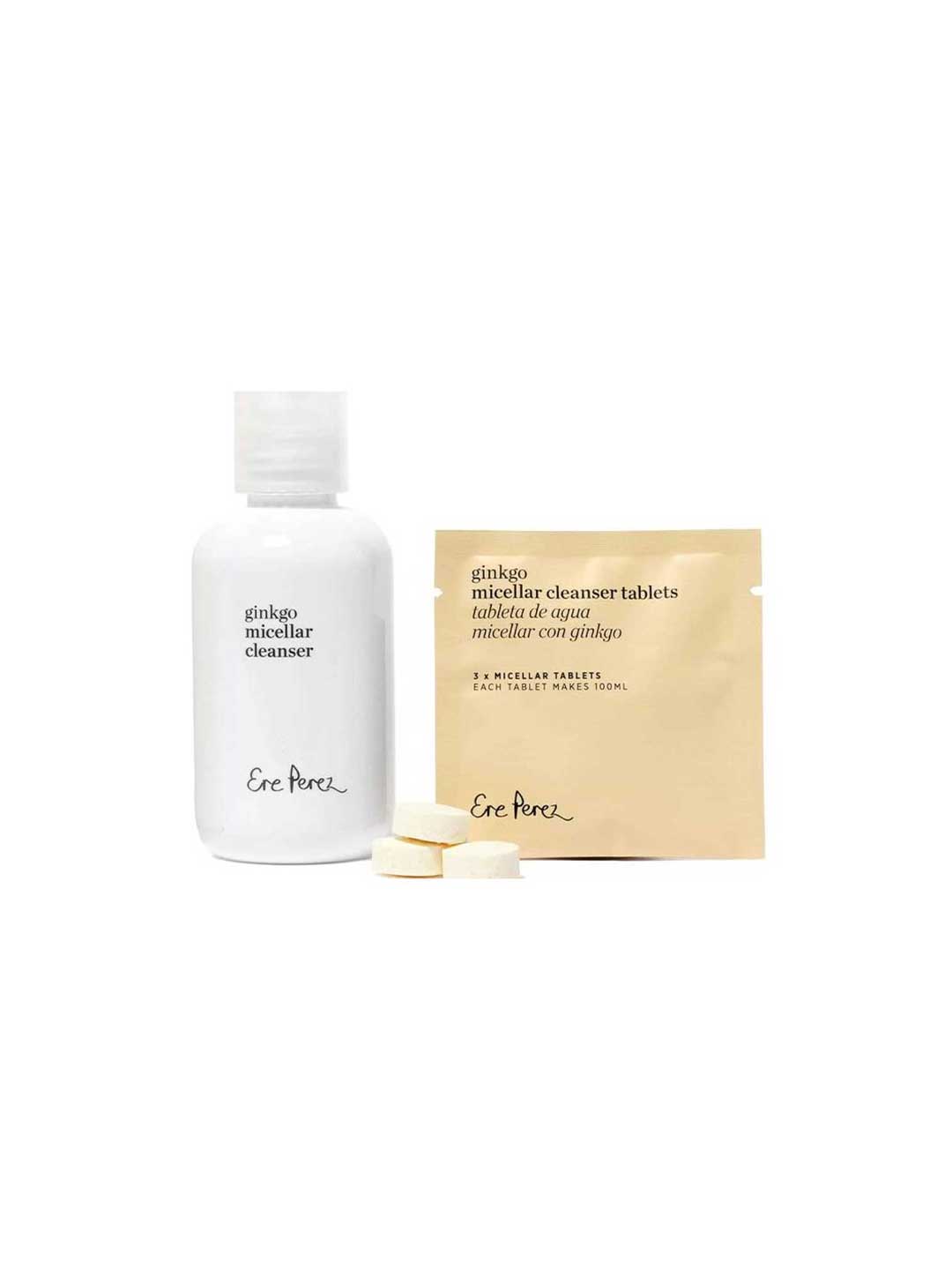 A white bottle of Ere Perez Ginkgo Micellar Cleanser 300ml stands beside a beige packet of fragrance-free makeup remover tablets and two cleanser tablets—ideal for sensitive skin—on a white background.