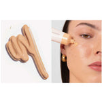 A swatch of Ere Perez Oat Milk Foundation 30ml in shade Honey (light warm) is shown on the left, and a person applies the medium-coverage natural liquid foundation to their cheek on the right. Text below reads: shade honey | light warm.