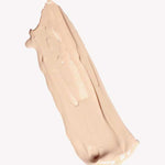 A smooth, beige smear of Ere Perez Oat Milk Foundation 30ml with medium coverage on a plain white background.