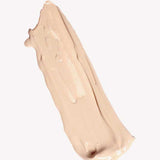 A smooth, beige smear of Ere Perez Oat Milk Foundation 30ml with medium coverage on a plain white background.
