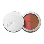 The Ere Perez Rice Powder Blush & Bronzer - Brooklyn 9g is a vegan duo in a round compact with a silver lid, featuring pink blush on the left and warm brown bronzer on the right.