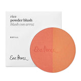 The Ere Perez Rice Powder Blush - Bondi Refill 9g is a vegan, circular, two-toned blush in peach and coral shades with Ere Perez embossed, shown before its white box labeled "Rice Powder Blush" and "Ere Perez" in black.