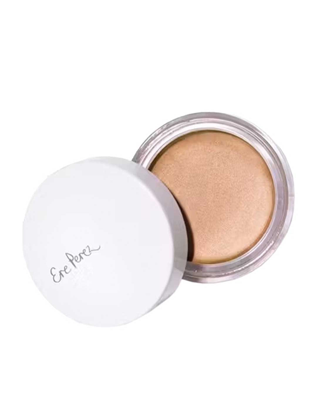 A small round container of Ere Perez Vanilla Highlighter Balm with a white lid partially open, revealing creamy beige highlighter. "Ere Perez" appears in gray script on the lid, hinting at its natural brightening effect.