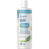 A white 16 fl oz (473 mL) bottle of Essential Oxygen Toothpaste & Mouthwash Brushing Rinse, labeled dentist recommended for whiter teeth and fresher breath, is organic, peppermint-flavored, fluoride-free, and features plant illustrations.