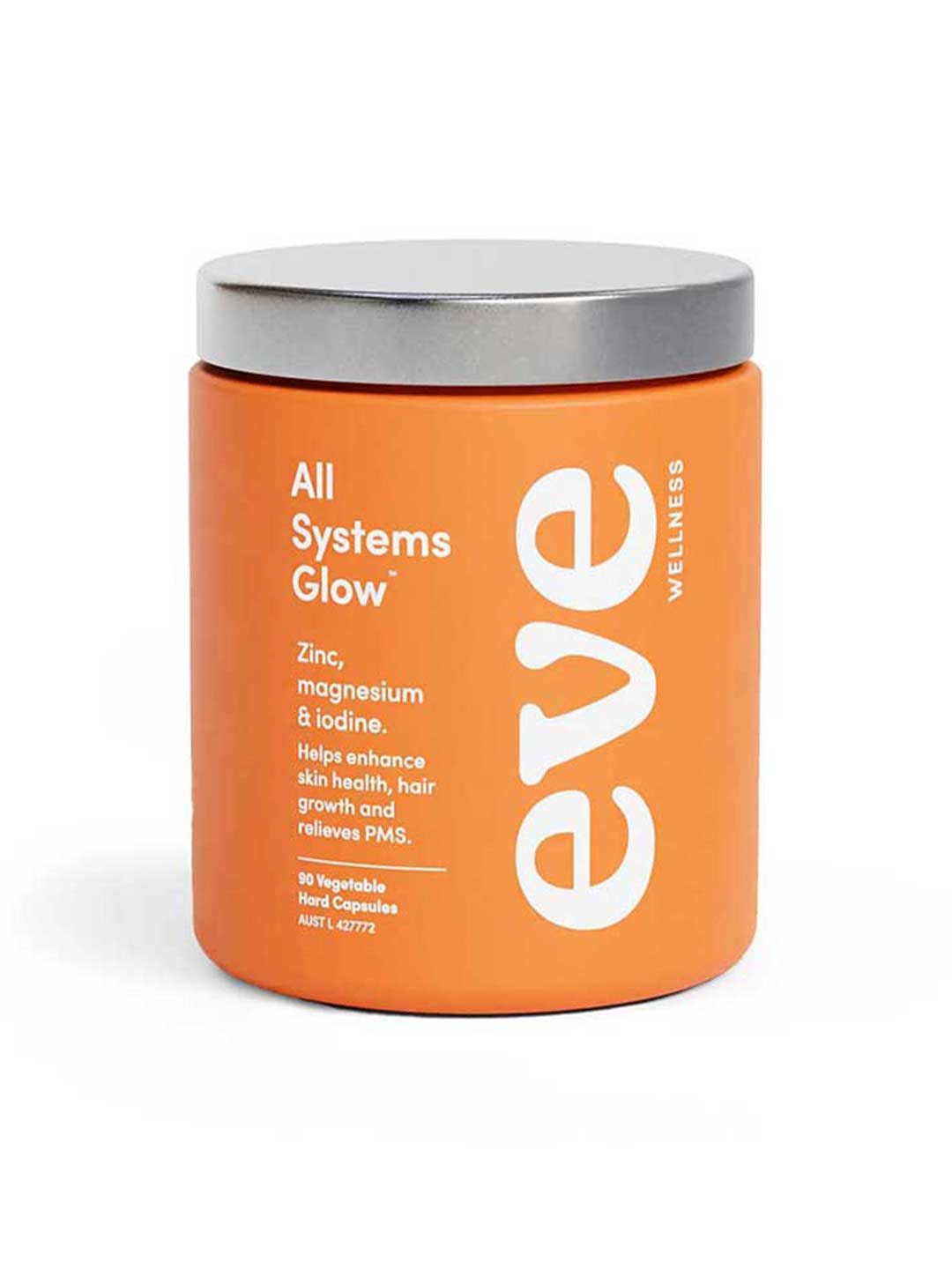 An orange Eve Wellness All Systems Glow 90 caps jar with a silver lid features zinc, magnesium glycinate & iodine to support skin health, hair growth, and PMS relief. Contains 90 vegetable capsules.
