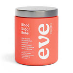 A red jar labeled Eve Wellness Blood Sugar Babe 84g with a silver lid. Supports blood sugar, metabolism, hormones, and acne relief. Contains 84g of myo-inositol powder in an oral formula.