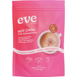 A pink resealable pouch labeled “Eve Wellness Hot Choc With Ashwagandha 120g” features a cup of sugar-free hot chocolate and highlights “no added sugar,” “dairy free,” “gluten free,” “vegan,” and supports hormonal balance.