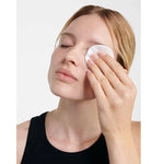 Model removing eye make-up with Dr Hauschka Eye Make-up Remover