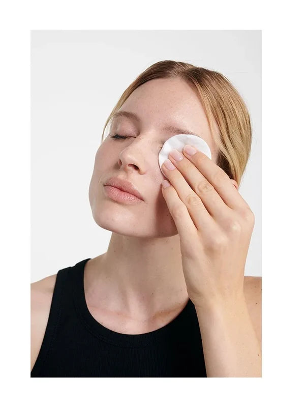 Model removing eye make-up with Dr Hauschka Eye Make-up Remover