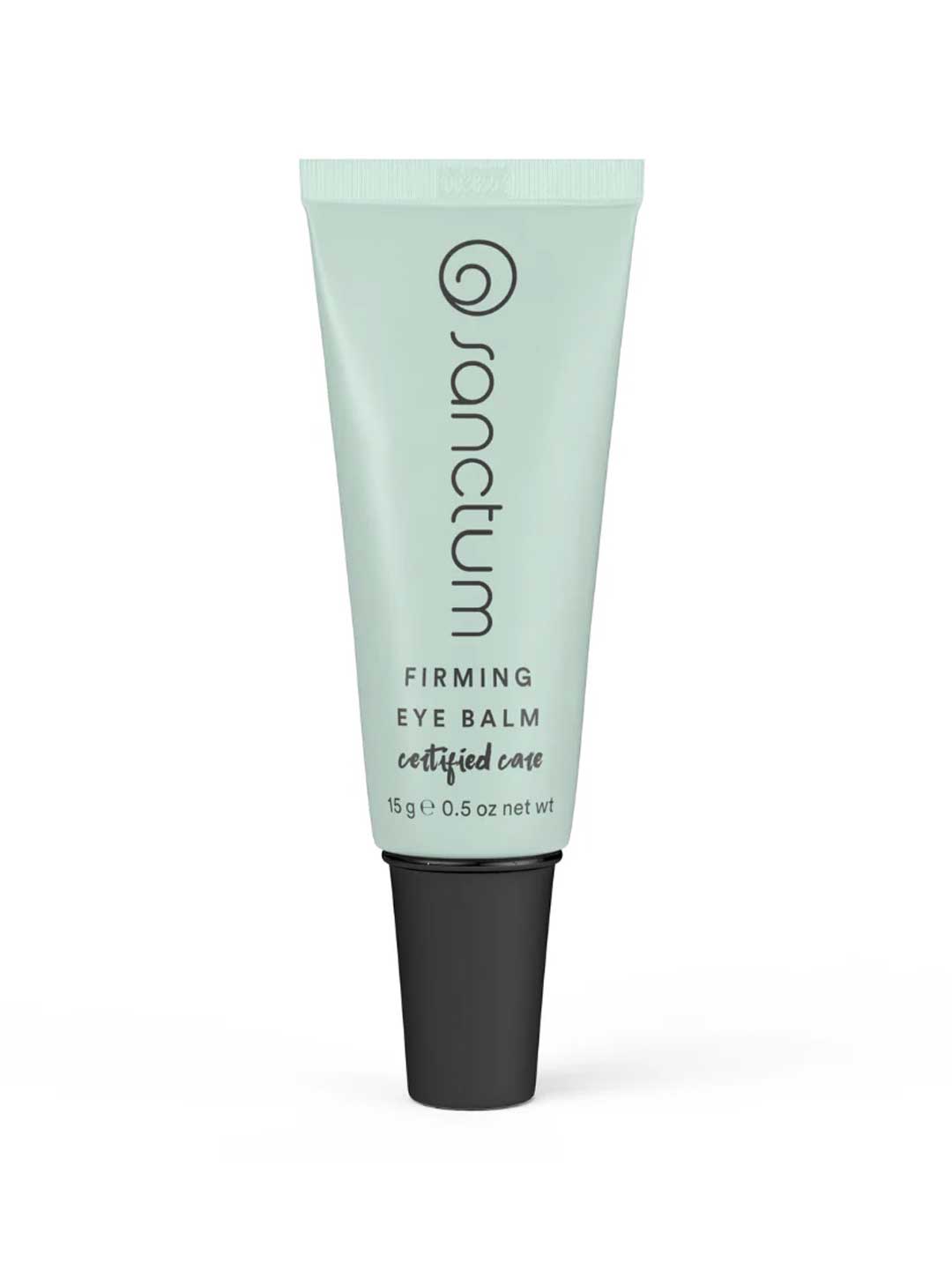 A light green tube of Sanctum Firming Eye Balm stands upright with a black cap. This organic eye cream, certified care by Sanctum, contains 15g (0.5 oz) and is enriched with hyaluronic acid for extra hydration.