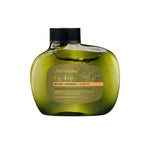 A green, oval bottle of Antipodes Fig + Feijoa Repair & Nourish Shampoo 340ml with a black cap and label, featuring a silicone-free formula to nourish and repair damaged hair.