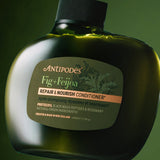 Antipodes Fig and Feijoa Repair and Nourish Conditioner bottle with product pour
