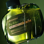 Antipodes Fig and Feijoa Repair and Nourish Shampoo bottle with product pour