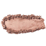 A swatch of 100% Pure Fruit Pigmented® Eye Shadow 2g by 100% Pure is smeared on a white background, showing light brown color with crushed edges framing a smooth center.