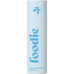 The Foodie Blue Raspberry Smooch Lip Balm 10g comes in a light blue, plastic-free cylindrical tube with "foodie" in bold blue letters and "BLUE RASPBERRY SMOOCH" below, featuring a small abstract blue logo near the top.