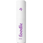 A white spray bottle labeled "Foodie" with purple text and a small icon contains Foodie Passion Pop Face & Body Mist 10ml, a minimalist teen skincare mist offering a refreshing passionfruit scent for face and body.