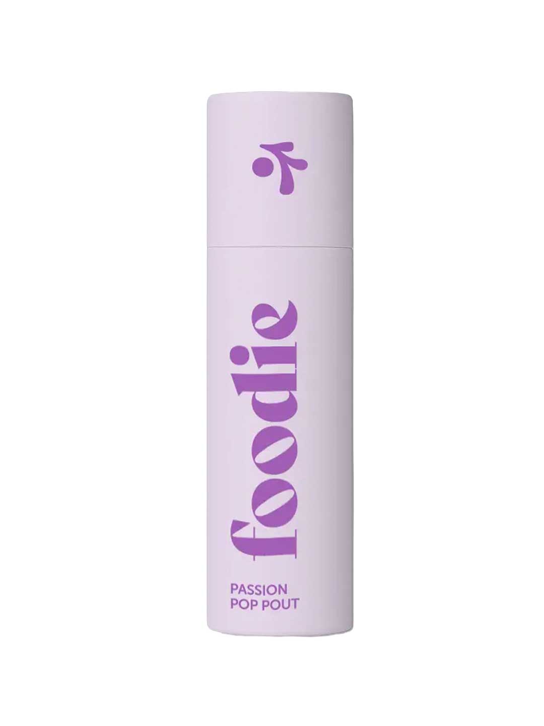 Foodie Passion Pop Pout Lip Balm 10g comes in a light purple cylindrical bottle with "foodie" in bold purple and "PASSION POP POUT" on the label, all packaged in natural, plastic-free packaging.
