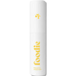 A white cylindrical spray bottle labeled “foodie” in large yellow text with “PINEAPPLE CRUSH MIST” below, this 10ml Foodie Pineapple Crush Face & Body Mist features a small yellow abstract logo—ideal as a refreshing, natural face and body mist.