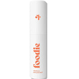 A white cylindrical 10ml spray bottle labeled “Foodie” in orange text holds the Tropical Pavlova Face & Body Mist. Minimalistic design with a small orange icon, perfect for a burst of tropical freshness in your routine.