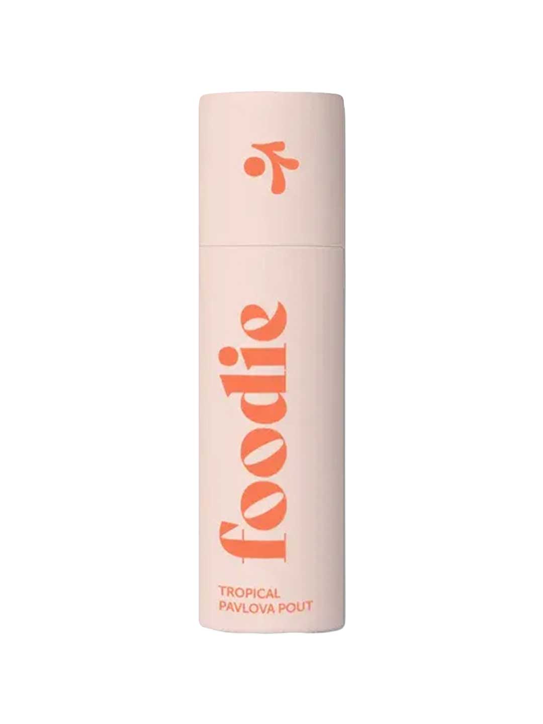 A light pink cylindrical bottle of Foodie Tropical Pavlova Pout Lip Balm 10g features large orange "foodie" lettering with "TROPICAL PAVLOVA POUT" below, both vertically aligned. The cap has an orange abstract design and is plastic-free.