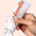 Model using Foodie Tropical Pavlova Body Moisturiser