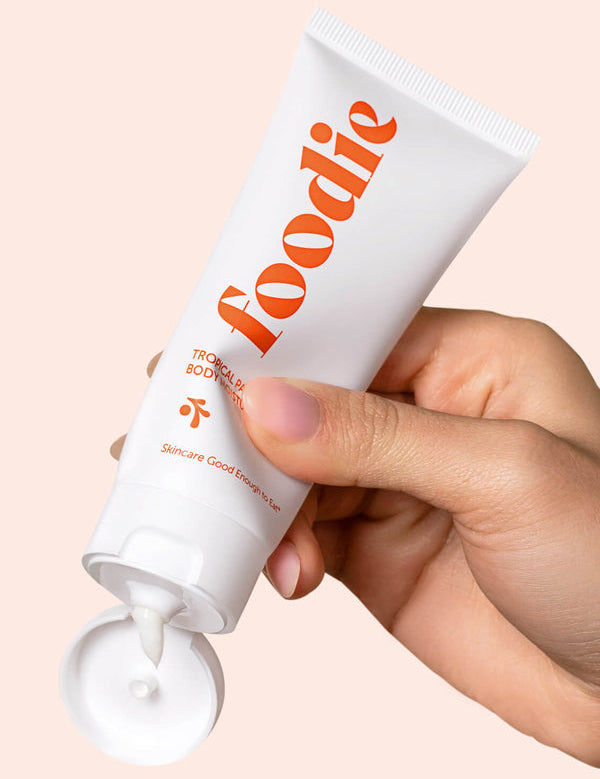Model using Foodie Tropical Pavlova Body Moisturiser
