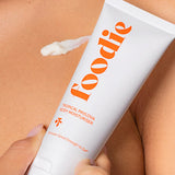 Applying Foodie Tropical Pavlova Body Moisturiser