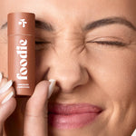 Model wearing Foodie Chocolate Crunch Kiss Lip Balm