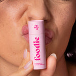 Model wearing Foodie Strawberry Sundae Smooch Lip Balm