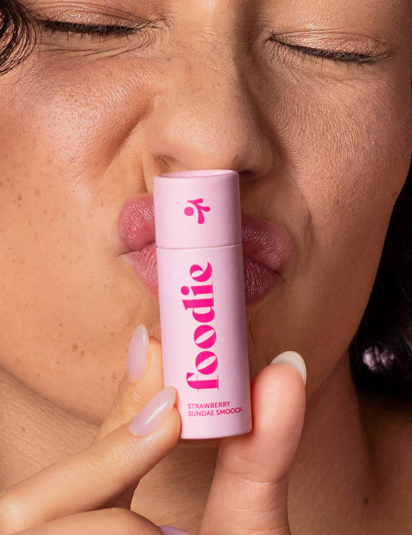 Model wearing Foodie Strawberry Sundae Smooch Lip Balm